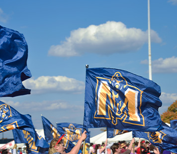 A Racers flag waves on a sunny day.